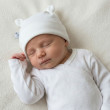 Dojčenská nasadzovacia bavlnená čiapka s uškami Biela Babyservice - Veľ. 50