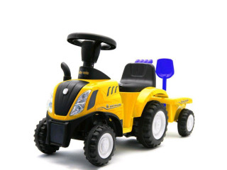 Detské odrážadlo traktor s vlečkou a náradím Baby Mix New Holland žltý