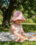 Dojčenský mušelínový klobúčik pink New Baby